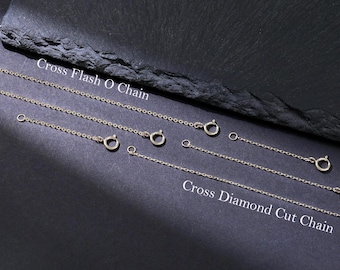 May include: Two different types of silver chains, one labeled "Cross Flash O Chain" and the other labeled "Cross Diamond Cut Chain".