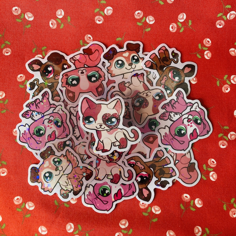May include: A collection of colorful cartoon animal stickers with glitter accents. The stickers feature various animals, including cats, dogs, and other creatures. The stickers are perfect for adding a touch of whimsy to any project.