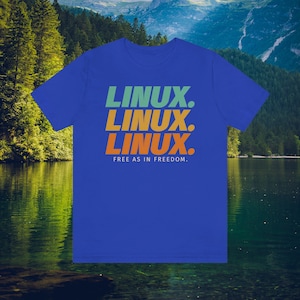 May include: A royal blue t-shirt with the word "LINUX" stacked three times in green, orange, and orange. Below the word "LINUX" is the text "FREE AS IN FREEDOM."