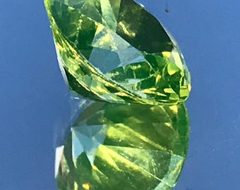 Faceted Peridot Gemstone: 5 Carat Oval Cut, 12mm