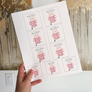 May include: Printable sheet of eight gift tags with a pink bow and the text "You've touched my heart".