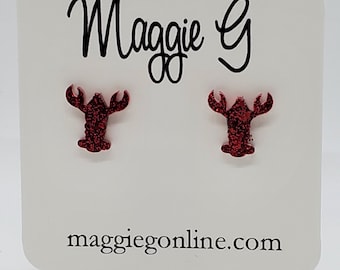 May include: Red glitter lobster earrings on a white card with the text "Maggie G" and "maggieonline.com".