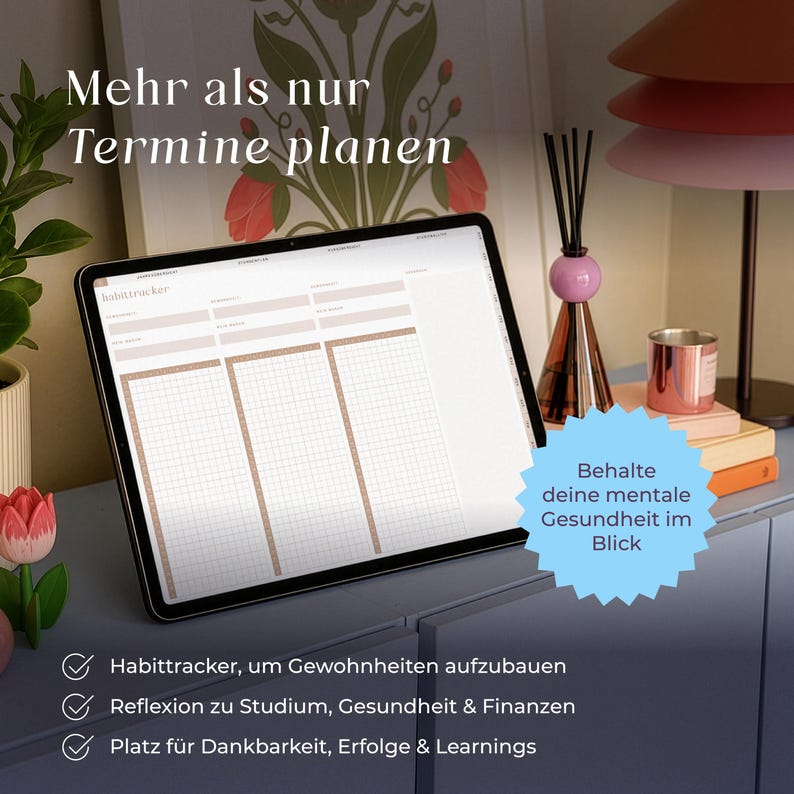 May include: A digital tablet displaying a habit tracker template with grid sections. The screen shows text in German, including 'Mehr als nur Termine planen' and 'Behalte deine mentale Gesundheit im Blick'. The tablet is placed on a surface.
