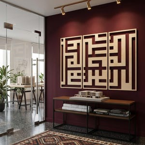 May include: Three-panel wooden wall art with a geometric design hangs above a dark wood and black metal console table. The table displays architectural models, blueprints, and books. The room features a glass door and a patterned rug.