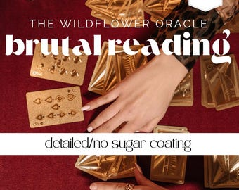 May include: A deck of gold-colored oracle cards featuring the text THE WILDFLOWER ORACLE, brutal reading, and detailed/no sugar coating. The cards are spread out on a dark red surface, with one card showing a nine of spades design in gold.