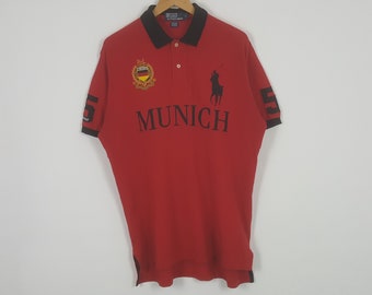 Polo vintage par Ralph Lauren Munich Allemagne drapeau logo polos