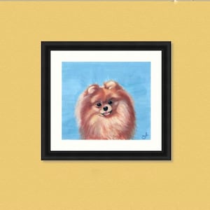 May include: A framed square art print featuring a painting of a fluffy orange Pomeranian dog against a solid light blue background. The artwork is encased in a simple black frame with a white mat border, displaying a signature in the corner.
