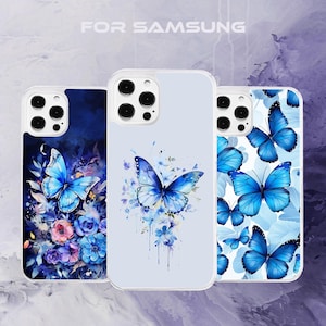 May include: Three phone cases with different butterfly designs. The cases are white with a blue and white watercolor butterfly design, a blue and white butterfly design with a floral background, and a blue and white butterfly design with a white background.