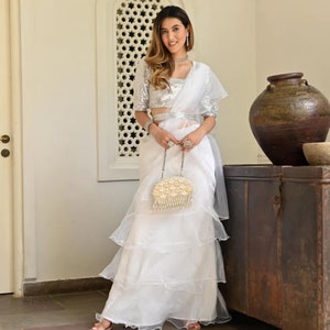 Indian wedding party wear saree in white organza with stitched designer blouse and belt, modern Indowestern style, ready-to-wear for women