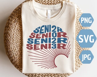 May include: A white t-shirt featuring a red and blue graphic design that reads "Senior" multiple times, accompanied by a sunburst design.