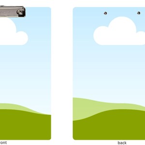May include: A clipboard with a blue sky and green grass background. The front of the clipboard has a silver clip and a white cloud. The back of the clipboard has two silver dots.