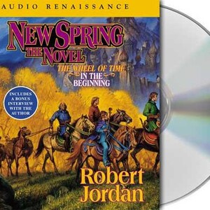 May include: A CD case for "New Spring: The Novel" by Robert Jordan, part of "The Wheel of Time" series. The cover art features riders on horseback, with text that reads "Audio Renaissance" and "Includes a Bonus Interview with the Author."