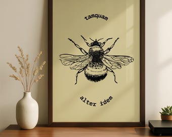 May include: A framed print featuring a detailed black and white illustration of a bee. The bee is centered on a light yellow background, with the words "tamquam" above and "alter idem" below. The frame is dark brown.