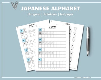 May include: A Japanese alphabet test paper with three sections: Katakana, Hiragana, and a practice section. The Katakana section shows the characters 'A', 'I', 'U', and 'E' with their corresponding sounds. The Hiragana section shows the characters 'O', 'Ka', 'Ki', and 'Ku' with their corresponding sounds. The practice section has a blank grid for writing the characters.