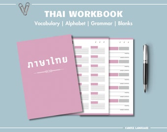 May include: A pink Thai workbook with the title "Thai Workbook" and the words "Vocabulary | Alphabet | Grammar | Blanks". The workbook is open to show pages with fill-in-the-blank sections. A silver pen and paper clips are also in the image.