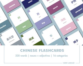 May include: A set of colorful flashcards with Chinese characters and English translations. The flashcards feature words like "woman", "table", "dog", "car", "spoon", "passport", "tree", "teacher", "carrot", and "护照".