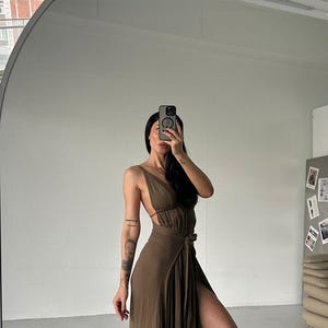modest sexy clothes Kylie Jenner turns up the heat in a tiny hot pink bikini main image 0