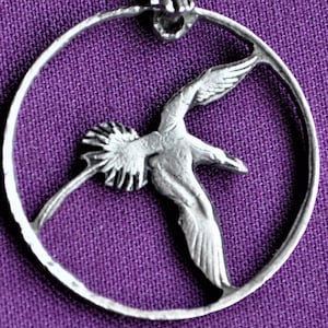 Bermuda Long Tailed Bird Cut Coin Pendant Necklace