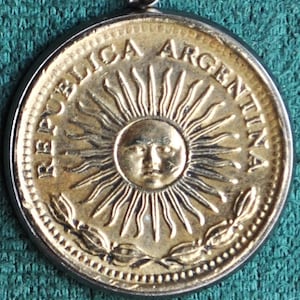 Argentina Sun of May Coin Pendant Necklace