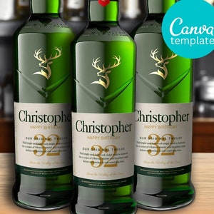 May include: Three green glass bottles of whiskey with gold labels. The labels feature a stag head logo and the text "Christopher Happy Birthday Our Original Twelve" with the number 32.