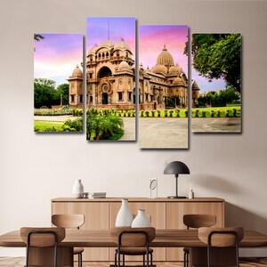 May include: A multi-panel canvas print depicting a large, ornate building with multiple domes. The building is a light brown colour and is surrounded by lush green trees and grass. The sky is a soft pink and purple.