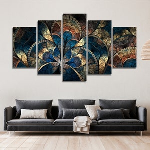 May include: A five-piece canvas wall art set featuring a colorful abstract design with blue, gold, and brown hues. The design resembles a flower with intricate patterns and textures.
