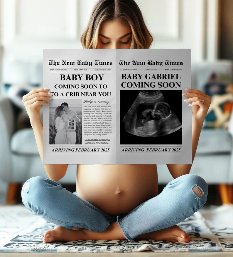 May include: A woman sits cross-legged, holding two newspaper-style announcements. The headlines read "The New Baby Times" and announce "Baby Boy" and "Baby Gabriel" are "Coming Soon." The announcements include sonogram images and the date "February 2025."