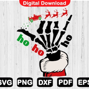 May include: A black skeleton hand wearing a Santa hat and holding a red car with the words "ho ho" on either side.