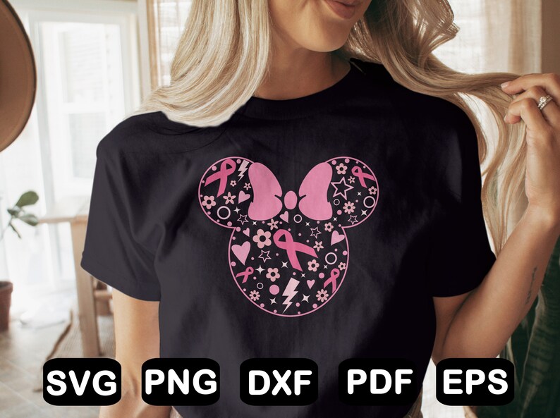 May include: A black t-shirt with a pink and white design of a Mickey Mouse head with a bow. The design is filled with pink ribbons, hearts, stars, and flowers. The text "SVG PNG DXF PDF EPS" is at the bottom of the image.