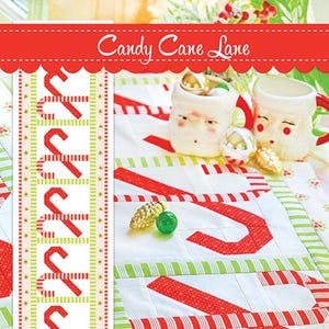 May include: A festive Christmas-themed image featuring a table runner, table topper, and placemats with candy cane designs. The text "Candy Cane Lane" is displayed at the top. The image also includes Santa mugs and decorative ornaments. The products are from Fig Tree & Co.