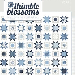 May include: A quilt pattern featuring a repeating star design in shades of blue and white. The pattern includes the text "thimble blossoms" and "SAND&SEA". The quilt is a fat quarter friendly coastal quilt.
