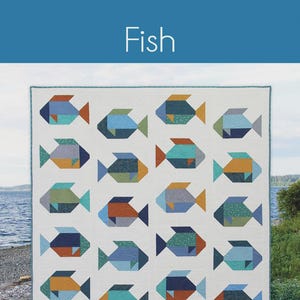 May include: A white quilt featuring a repeating pattern of geometric fish in shades of blue, orange, and green. The word "Fish" is at the top. The quilt is a fat quarter quilt in 3 sizes.