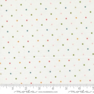 May include: White fabric with a repeating pattern of colorful polka dots in shades of pink, green, blue, and orange. The fabric has a ruler printed along the bottom edge.