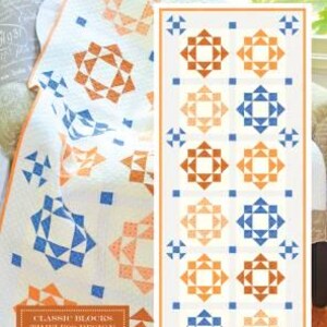 May include: A quilt and a pattern featuring the text "August Blooms." The quilt has a white background with orange and blue geometric star patterns. The pattern shows the same design. The text "Classic Blocks Timeless Design" is also visible.