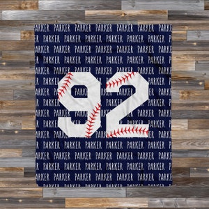 May include: A blue and white baseball blanket with the number "92" in white with red stitching. The number is surrounded by the name "Parker" repeated in white text.
