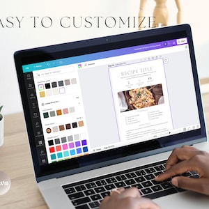 May include: A laptop computer with a white background and the Canva logo on the bottom left corner. The screen shows a recipe template with a photo of pasta with a white background and the text "RECIPE TITLE" in a purple box. The laptop keyboard is visible with a person's hand typing on it.