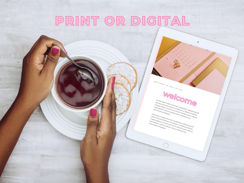 May include: A white tablet displaying a welcome message with pink text and a pink calendar on the screen. A person is holding a cup of tea and a spoon in their hands. The tablet is on a white wooden surface.