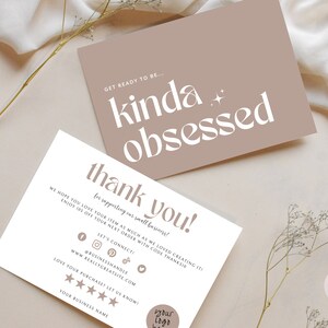 May include: Thank you card with a brown background and white text. The text says "Get ready to be... kinda obsessed." and "Thank you! for supporting our small business! We hope you love your item as much as we loved creating it! Enjoy 10% off your next order with code THANKSIO. Let's connect! @businesshandle www.reallygreatsite.com Love your purchase? Let us know! Your business name."