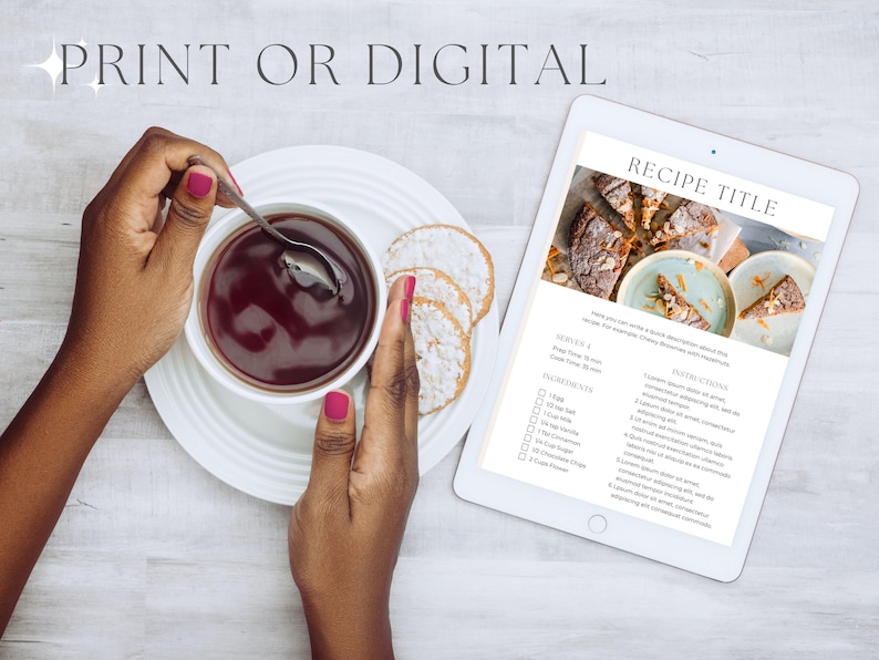 May include: A white tablet displaying a recipe titled "RECIPE TITLE" with a photo of a dessert. The recipe includes ingredients and instructions. The tablet is on a white wooden surface with a cup of tea and cookies.