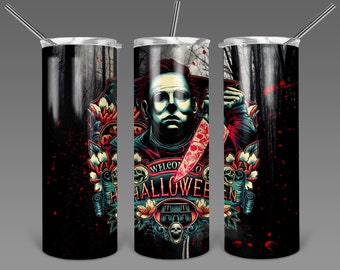May include: A Halloween-themed tumbler with a design of a character holding a bloody knife, and the words "WELCOME TO HALLOWEEN". The design includes skulls, flowers, and a haunted house, set against a dark forest backdrop. The tumbler has a silver straw and lid.