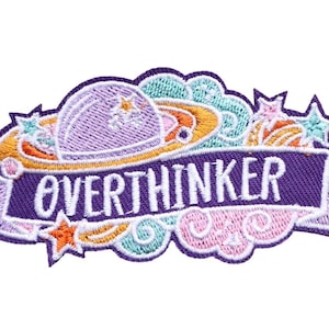 May include: Purple, pink and blue embroidered iron-on patch with a planet and stars design. The text "Overthinker" is written on a purple banner.