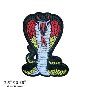 May include: Embroidered iron-on patch of a green, red, yellow, and white cobra with its hood raised. The patch is 2.5 inches by 3.25 inches and 6 cm by 8 cm.