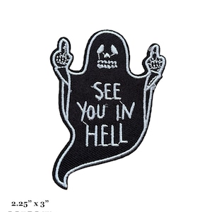 May include: Black iron-on patch featuring a white ghost giving the middle finger and the text "See You In Hell". The patch measures 5.5 cm by 7.5 cm.