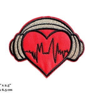 May include: Red heart-shaped patch with a black heartbeat line design, framed by tan headphones with black outlines. The patch measures 3 inches by 2.5 inches.