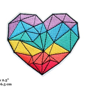 May include: Embroidered heart patch with a geometric design. The patch features a rainbow of colors, including red, orange, yellow, green, blue, and purple. The patch measures 3 inches by 2.5 inches.