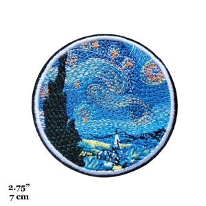 May include: A round embroidered patch featuring a blue and yellow starry night sky with a dark green tree in the foreground. The patch is 2.75 inches in diameter.