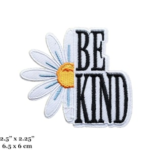 May include: White embroidered patch with a daisy and the text "BE KIND" in black lettering. The patch measures 2.5 inches by 2.25 inches.