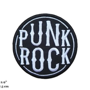 May include: A black and white embroidered patch with the text "Punk Rock" in a circle. The patch is 2.9 inches in diameter.