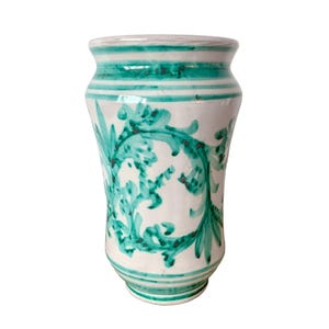 May include: A set of three ceramic mugs with a speckled, matte finish. The mugs are in shades of cream, light gray, and dark gray. Each mug has a simple, minimalist design, perfect for coffee or tea.