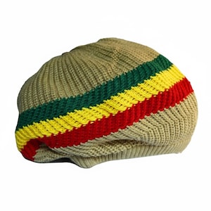 May include: A knitted beanie hat in a tan color with horizontal stripes of green, yellow, and red. The hat is made of a soft, textured material and is designed to fit snugly on the head. The stripes are evenly spaced and add a pop of color.